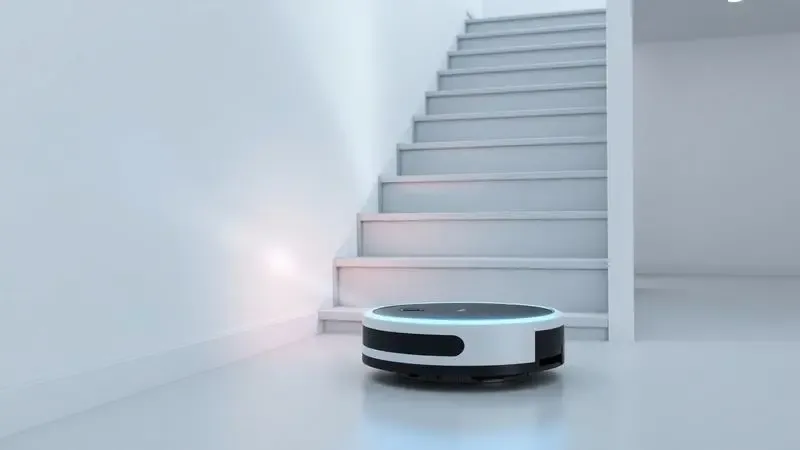 Ilustração 3D de um aspirador robô unbranded utilizando sensores para identificar e evitar a queda em uma escada moderna.