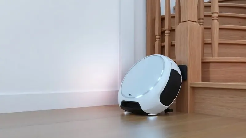 Ilustração 3D de sensores de um robô aspirador detectando o degrau de uma escada de madeira para evitar quedas.